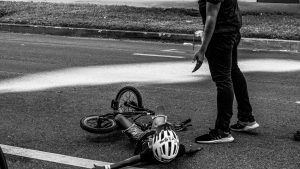 Child on the ground after a bike accident